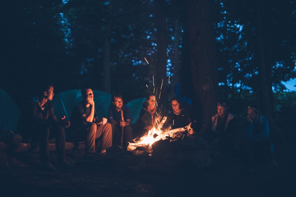 children camping at a bonfire